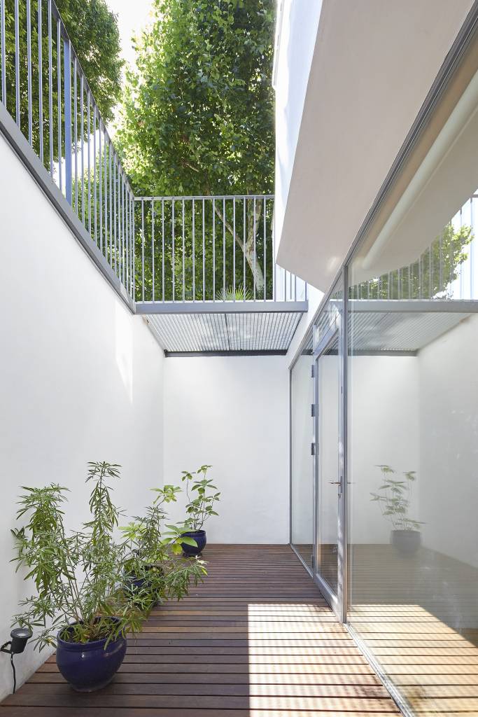 Hover House, a house in West London. The courtyard allows a fully glazed facade to the new lower floor